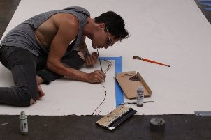 Brandon Boyd creating canvas for TOMS Shoes